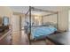 Spacious bedroom with a king-size bed and an en-suite bathroom at 1212 Windward Dr, Osprey, FL 34229