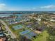 Community tennis and pickleball courts with water views at 1212 Windward Dr, Osprey, FL 34229