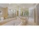 Spa-like bathroom featuring a large soaking tub and walk-in shower at 1233 N Gulfstream Ave # 502, Sarasota, FL 34236