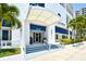 Modern building entrance with palm trees at 1233 N Gulfstream Ave # 502, Sarasota, FL 34236