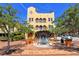 Three-story building with unique architectural details, located in a vibrant plaza at 1233 N Gulfstream Ave # 502, Sarasota, FL 34236