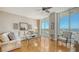 Spacious living area featuring hardwood floors and stunning water views at 1233 N Gulfstream Ave # 502, Sarasota, FL 34236