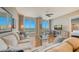 Bright living room with water views, hardwood floors, and comfy seating at 1233 N Gulfstream Ave # 502, Sarasota, FL 34236