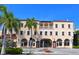 Elegant opera house with arched entryways and palm trees at 1233 N Gulfstream Ave # 502, Sarasota, FL 34236