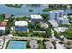 Aerial view of the condo building and its location near the water at 1255 E Peppertree Dr # 402, Sarasota, FL 34242