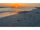 Tranquil beach scene at sunset, reflecting on the water at 1255 E Peppertree Dr # 402, Sarasota, FL 34242