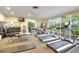 Modern fitness center with treadmills, elliptical machines and weights at 1255 E Peppertree Dr # 402, Sarasota, FL 34242