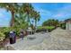 Outdoor grilling area with multiple grills and ample space for entertaining at 1255 E Peppertree Dr # 402, Sarasota, FL 34242