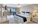 King-size bed, access to balcony and great views at 1255 E Peppertree Dr # 402, Sarasota, FL 34242