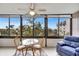 Bright sunroom with seating and city views at 1255 E Peppertree Dr # 402, Sarasota, FL 34242