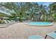 Relaxing community pool with plenty of lounge chairs at 1255 E Peppertree Dr # 402, Sarasota, FL 34242