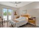 Bright bedroom with double doors leading to a private balcony at 1273 Boulevard Of The Arts, Sarasota, FL 34236