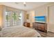 Bright bedroom with king-size bed, balcony access, and modern wood floors at 1273 Boulevard Of The Arts, Sarasota, FL 34236