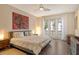 Spacious bedroom with hardwood floors and access to balcony at 1273 Boulevard Of The Arts, Sarasota, FL 34236