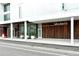 Modern building exterior with wood paneling and landscaping at 1273 Boulevard Of The Arts, Sarasota, FL 34236