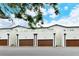 Three-unit building with attached garages and modern design at 1273 Boulevard Of The Arts, Sarasota, FL 34236