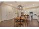 Modern kitchen with white cabinets, stainless steel appliances and a round dining table at 1273 Boulevard Of The Arts, Sarasota, FL 34236