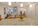 Kitchen island with granite countertop and seating area at 1273 Boulevard Of The Arts, Sarasota, FL 34236