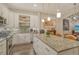 Modern white kitchen with granite countertops and stainless steel appliances at 1273 Boulevard Of The Arts, Sarasota, FL 34236