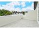 Private patio with a view of neighboring buildings at 1273 Boulevard Of The Arts, Sarasota, FL 34236