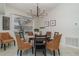 Spacious dining area with a modern chandelier and wicker chairs at 1507 91St Nw Ct, Bradenton, FL 34209