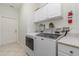 Laundry room with washer, dryer, and ample storage at 1507 91St Nw Ct, Bradenton, FL 34209