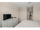 Bedroom with white dresser and striped bedding at 15147 Lyla Ter, Bradenton, FL 34211