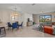 Open dining area with glass table and blue chairs at 15147 Lyla Ter, Bradenton, FL 34211