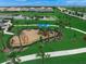 playground with play structures and shaded areas at 15147 Lyla Ter, Bradenton, FL 34211