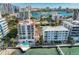 Aerial view of waterfront property with pool and marina at 166 Golden Gate Pt # 21, Sarasota, FL 34236