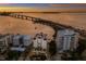 Aerial perspective showcasing the building and waterfront at 166 Golden Gate Pt # 21, Sarasota, FL 34236