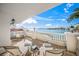 Enjoy a waterfront view from this relaxing balcony at 166 Golden Gate Pt # 21, Sarasota, FL 34236