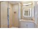 Clean bathroom with walk-in shower and updated vanity at 166 Golden Gate Pt # 21, Sarasota, FL 34236