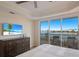 Spacious bedroom with water views and private balcony at 166 Golden Gate Pt # 21, Sarasota, FL 34236