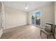 Bright bedroom with access to a private balcony and patio furniture at 166 Golden Gate Pt # 21, Sarasota, FL 34236