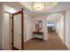 Bright entryway with wood floors and view to dining area at 166 Golden Gate Pt # 21, Sarasota, FL 34236