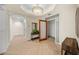 Elegant hallway with herringbone flooring and access to rooms at 166 Golden Gate Pt # 21, Sarasota, FL 34236