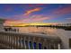 Stunning sunset view over the water from private balcony at 166 Golden Gate Pt # 21, Sarasota, FL 34236