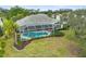 Aerial view of the house, highlighting the pool and backyard at 2008 Tocobaga Ln, Nokomis, FL 34275