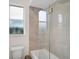 Bathroom with tub and glass shower enclosure at 2008 Tocobaga Ln, Nokomis, FL 34275