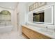 Modern bathroom with a large vanity and soaking tub at 2008 Tocobaga Ln, Nokomis, FL 34275