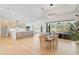 Open concept kitchen and dining area with modern appliances and hardwood floors at 2008 Tocobaga Ln, Nokomis, FL 34275