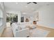 Relaxing living room with a sectional sofa and view of the pool at 2008 Tocobaga Ln, Nokomis, FL 34275