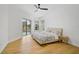 Main bedroom with hardwood floors and sliding doors to the pool area at 2008 Tocobaga Ln, Nokomis, FL 34275