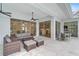 Covered patio with wicker furniture and view of kitchen at 2008 Tocobaga Ln, Nokomis, FL 34275