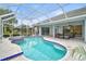 Relaxing pool and spa with covered patio and lush landscaping at 2008 Tocobaga Ln, Nokomis, FL 34275