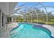 Inviting pool and spa with screened enclosure, perfect for relaxation at 2008 Tocobaga Ln, Nokomis, FL 34275