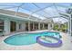 Resort-style pool and spa with covered patio for outdoor enjoyment at 2008 Tocobaga Ln, Nokomis, FL 34275