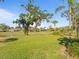 Backyard with a view of the golf course and pond at 2115 Calusa Lakes Blvd, Nokomis, FL 34275