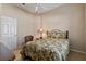 Well-lit bedroom with a ceiling fan and comfortable bed at 2115 Calusa Lakes Blvd, Nokomis, FL 34275